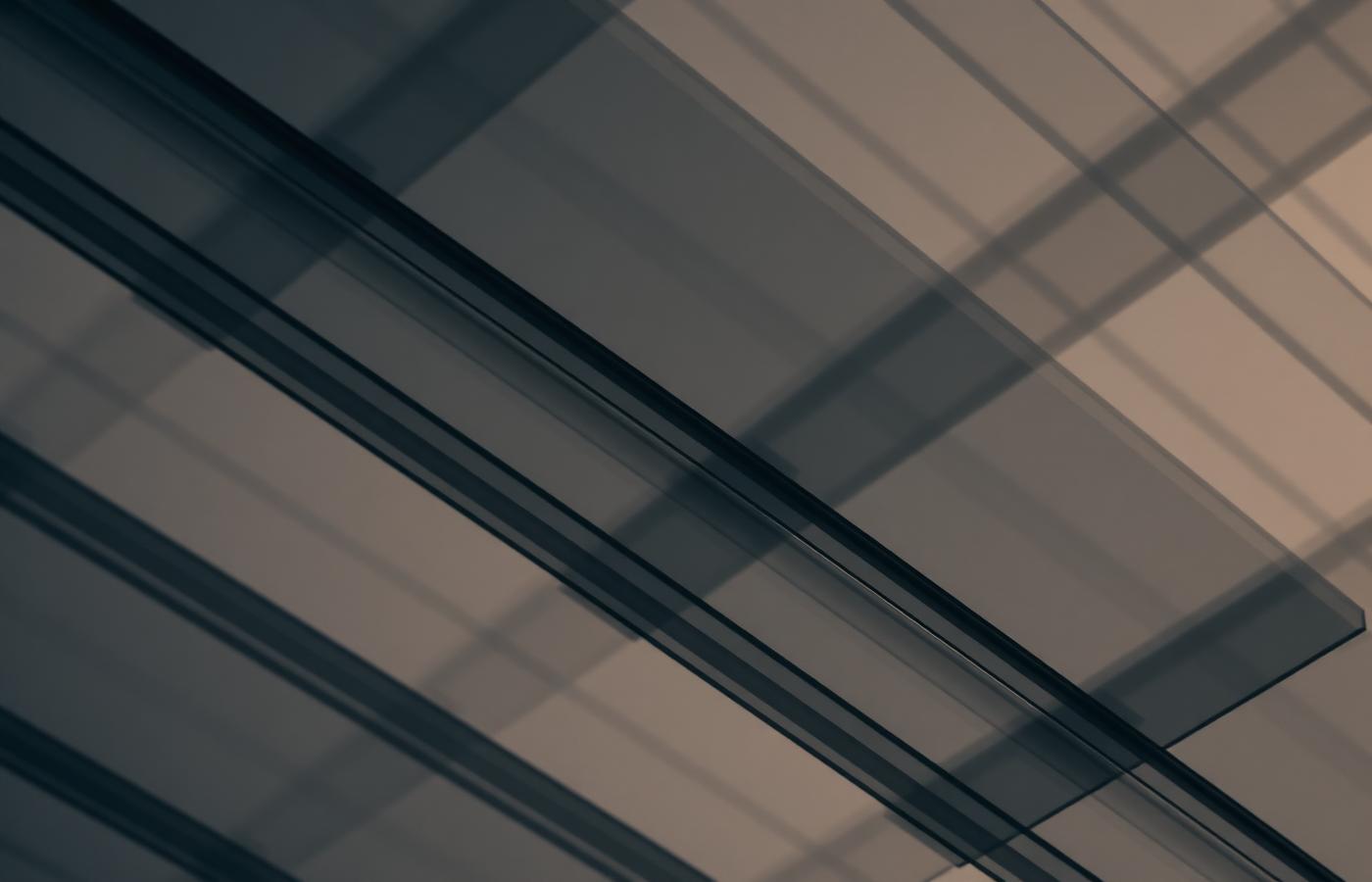Layered translucent glass panels representing cloud and platform architecture